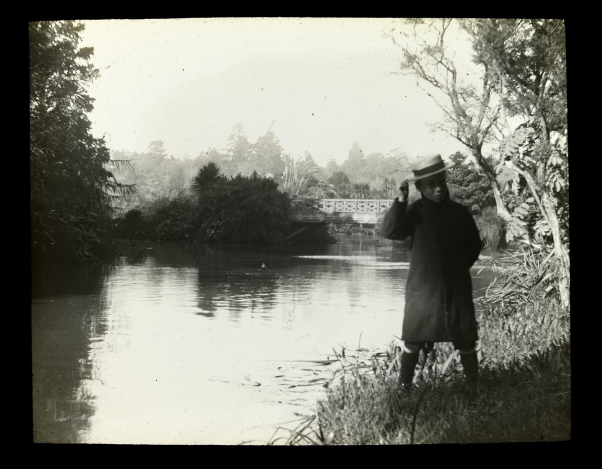 John [Wardell] standing beside lake - Melbourne Botanic Gardens or Yarra River ?, Melbourne City (1910–20)
