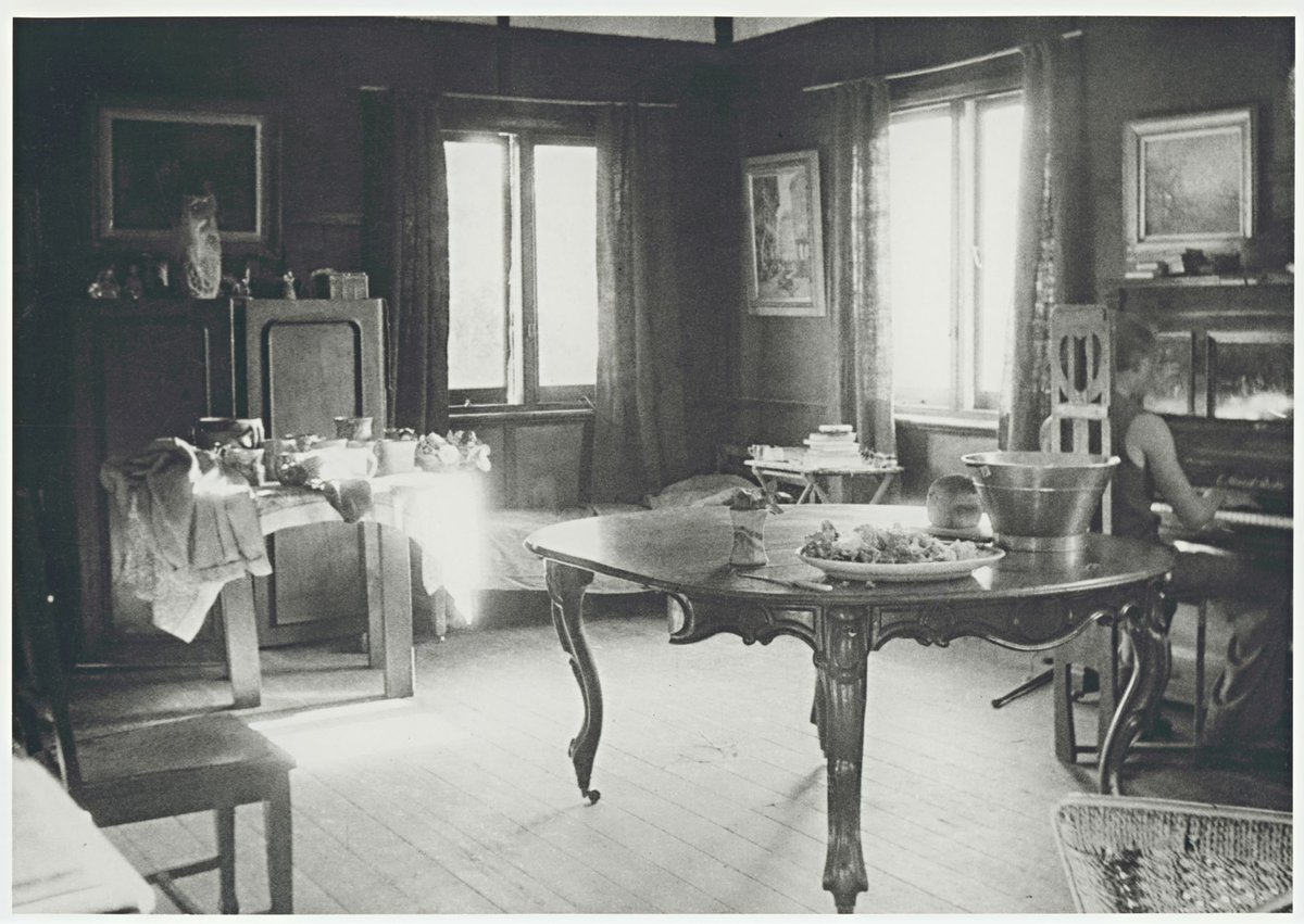 The brown room with John Perceval at the piano, Open Country, Murrumbeena (c. 1943)