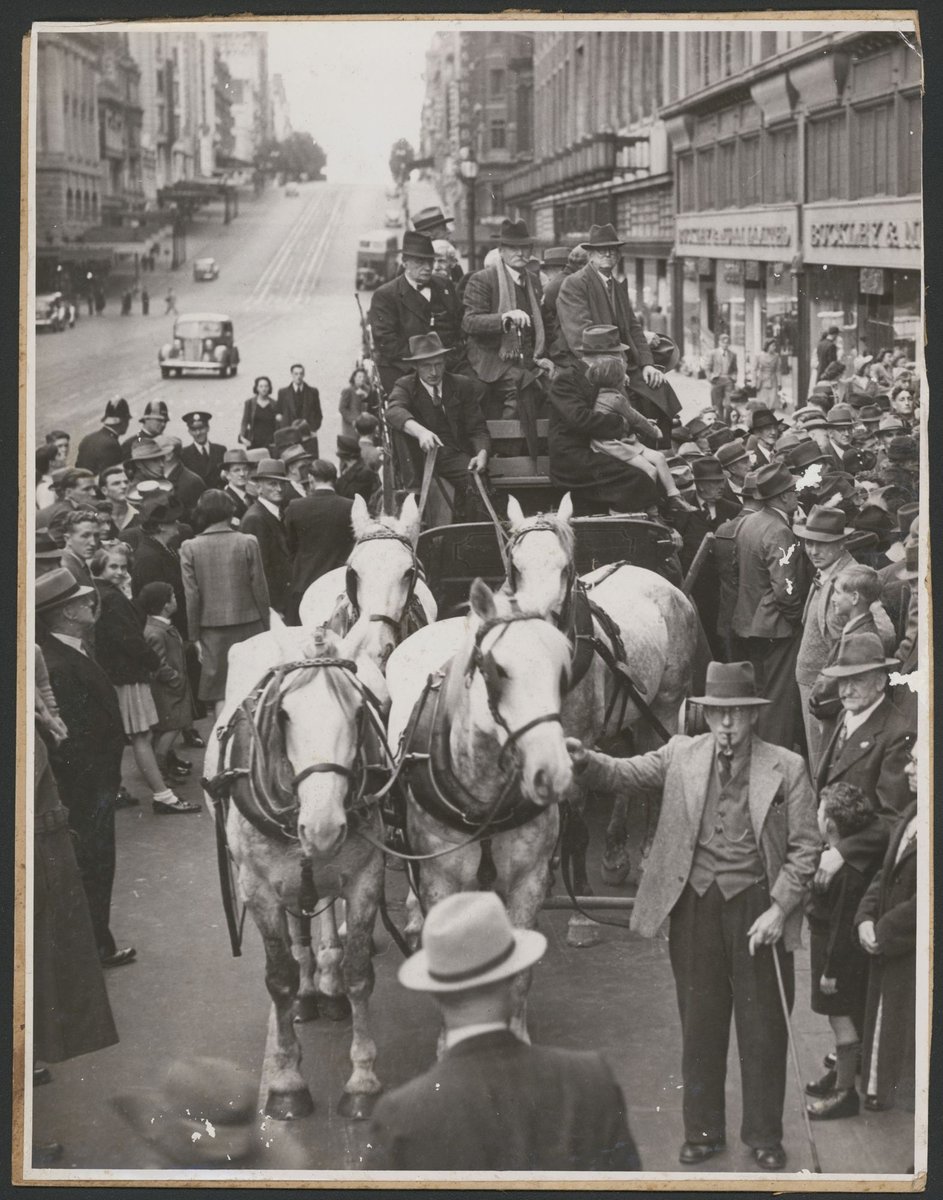[Former Cobb & Co. drivers seated on coach in Bourke Street, Melbourne], Melbourne City (1939–46)