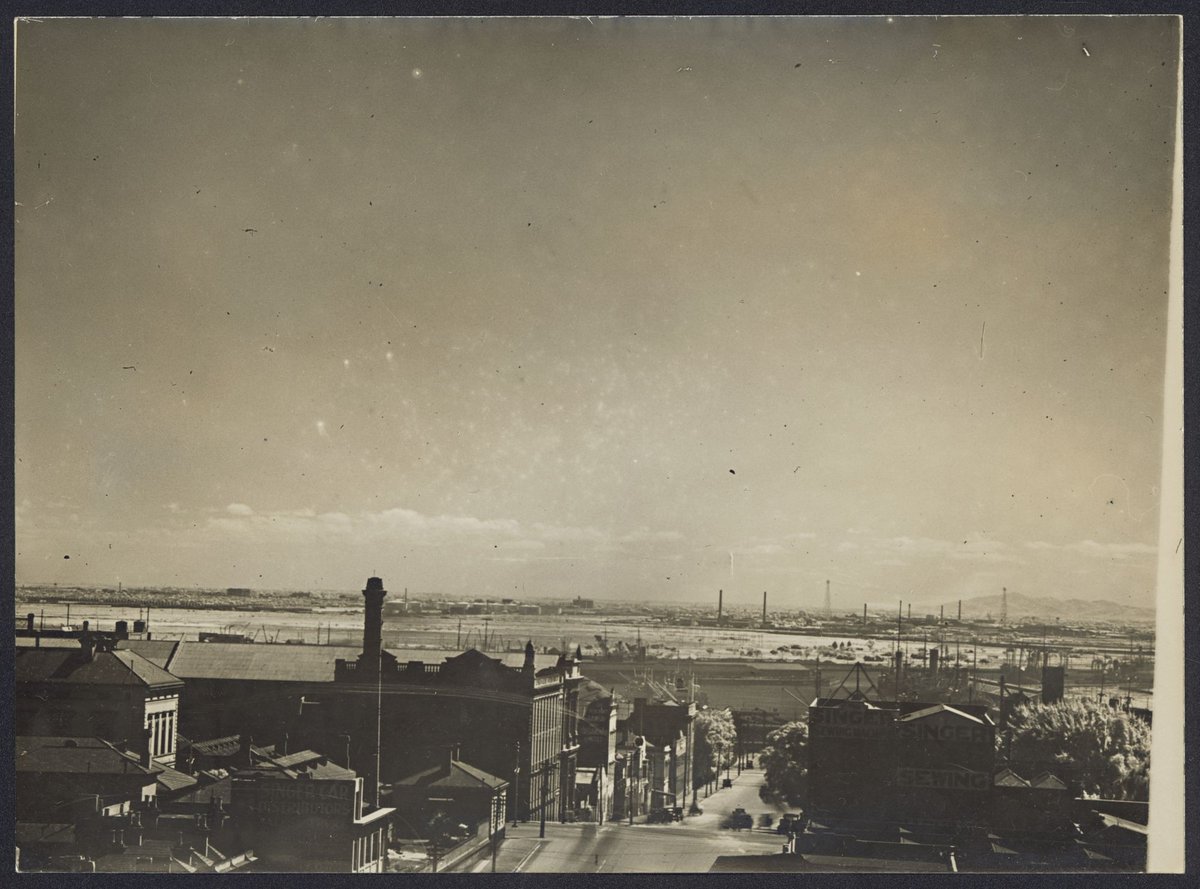 [Looking westerly along La Trobe Street, Melbourne, just east of William Street, Fisherman's Bend in the distance, You Yangs in the far distance], Port Melbourne (1920–40)