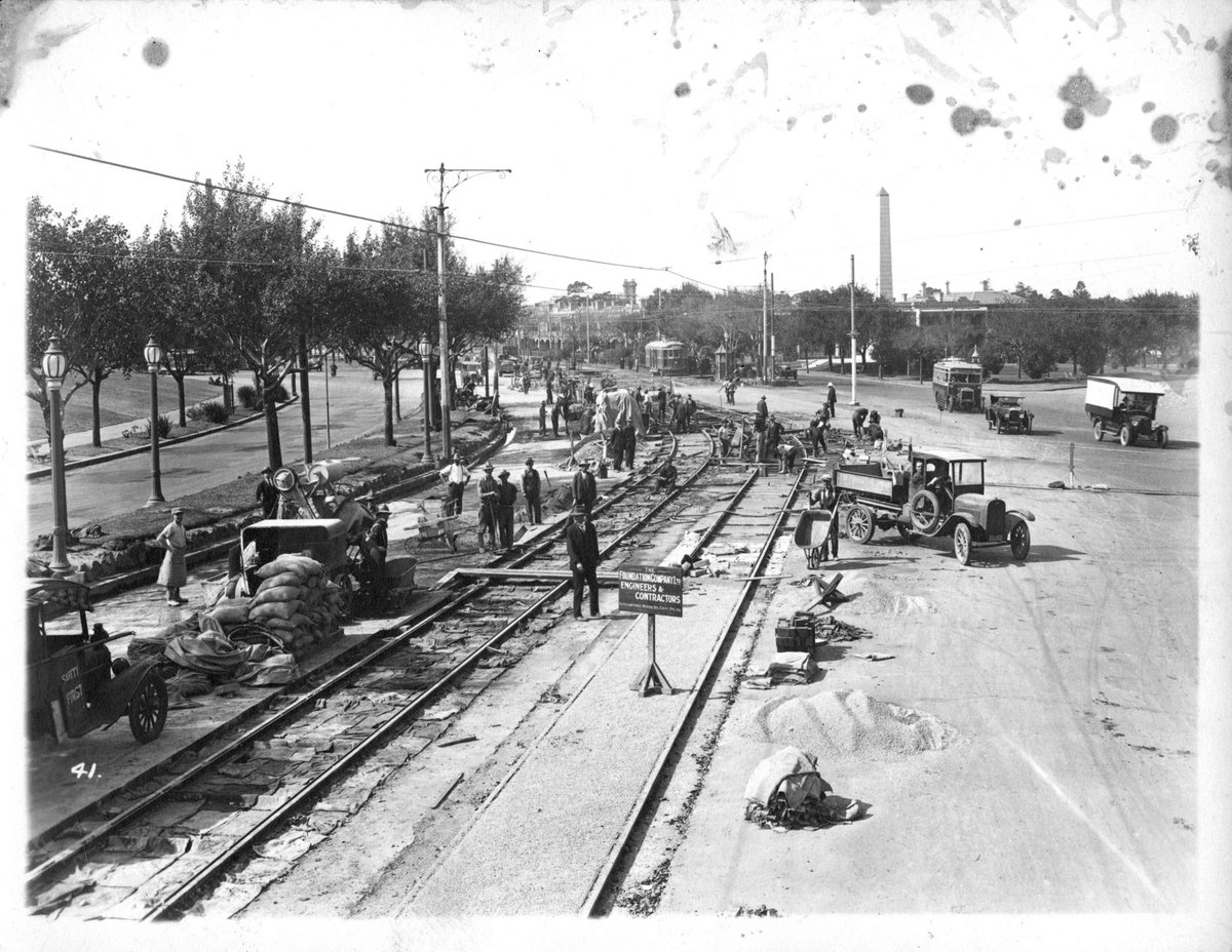 Electric tramway construction in St. Kilda Road, near the corner of Domain Road, Melbourne City (c. 1925)