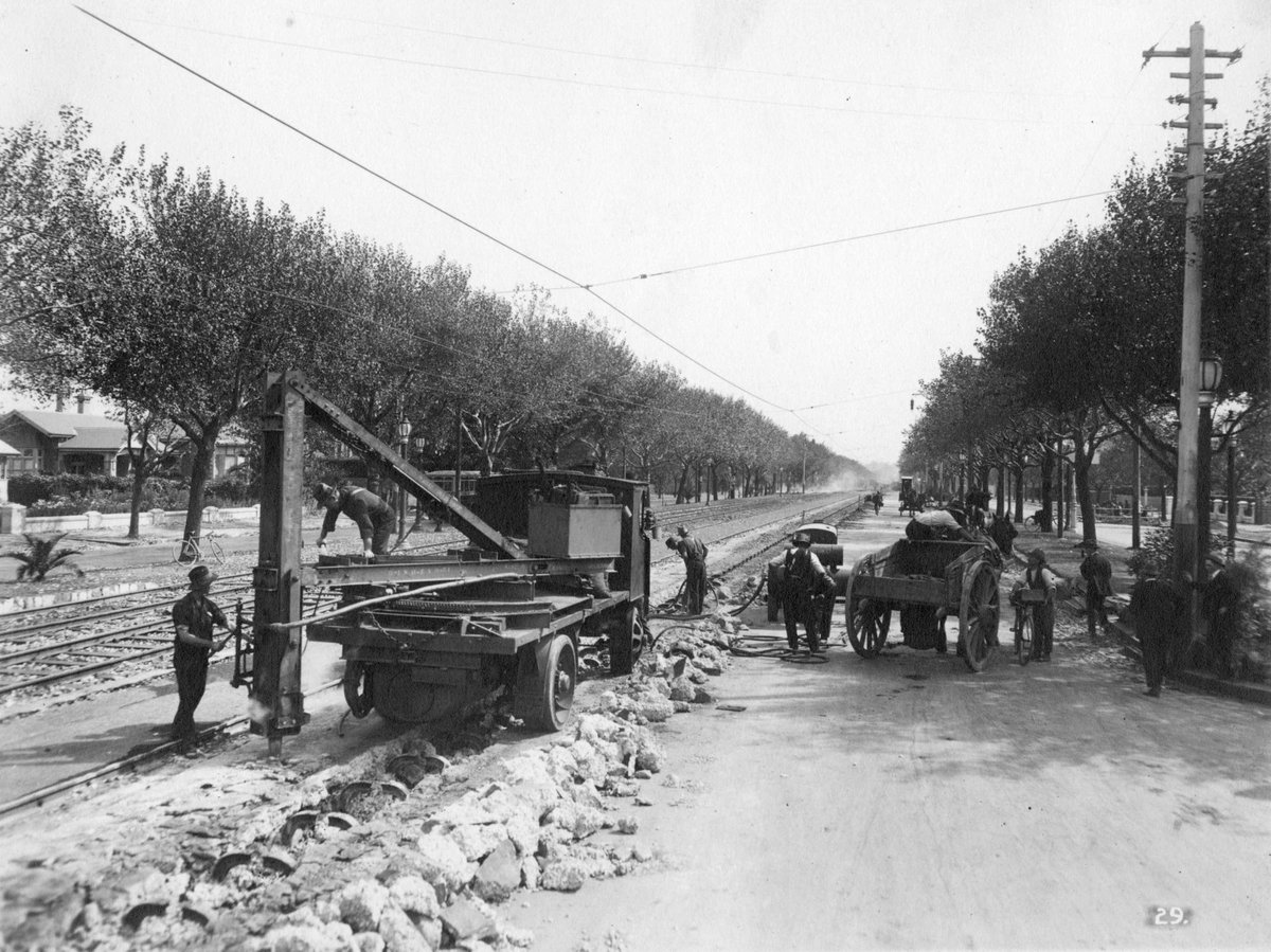 Work in St. Kilda Road, Melbourne, possibly digging up old cable tramway, Melbourne City (c. 1925)