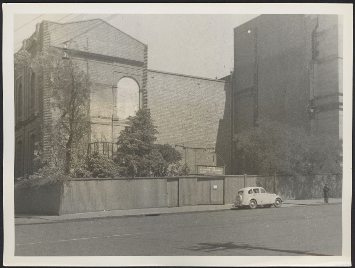 View of the Lending Library from Russell Street prior to removal of fences and trees, Melbourne City (1939)