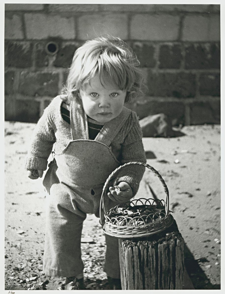Sweeney eating chocolate, Martin Street beach, Elwood (1946)