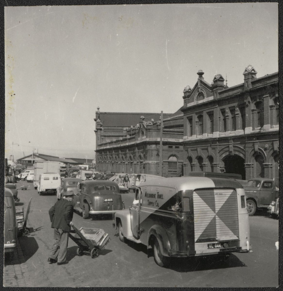 Busy street, possibly in West Melbourne (1940–50)