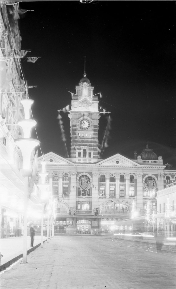Flinders Street Railway Station Tower decorated for the Centenary Celebrations of 1934, viewed from Elizabeth Street, Melbourne City