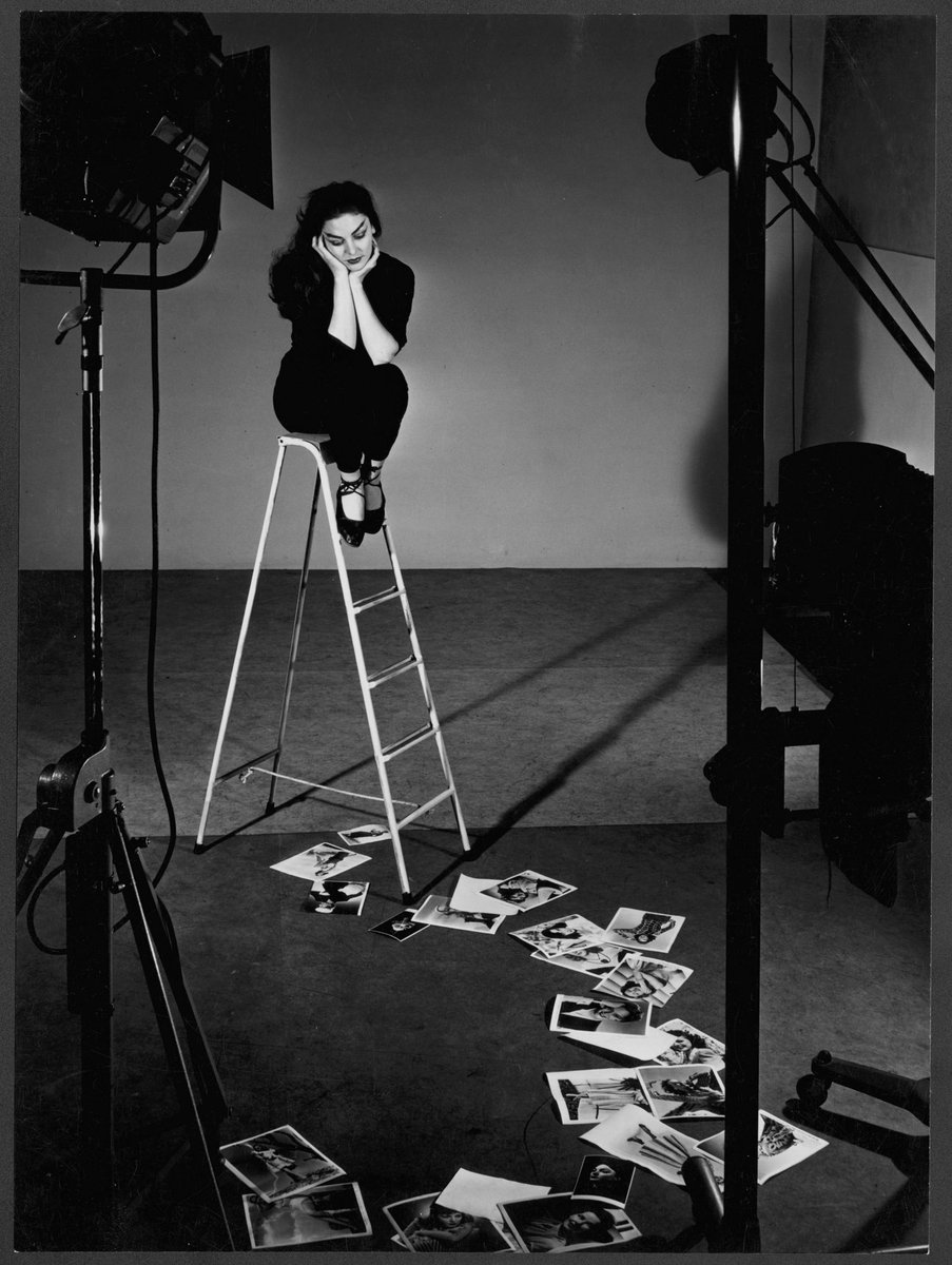 Model on ladder, Melbourne, Victoria (1952)