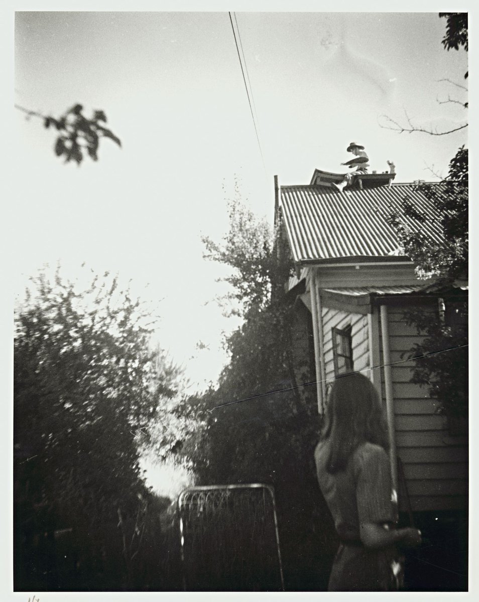 John Perceval painting on the roof watched by Mary Boyd, Open Country, Murrumbeena (1946)