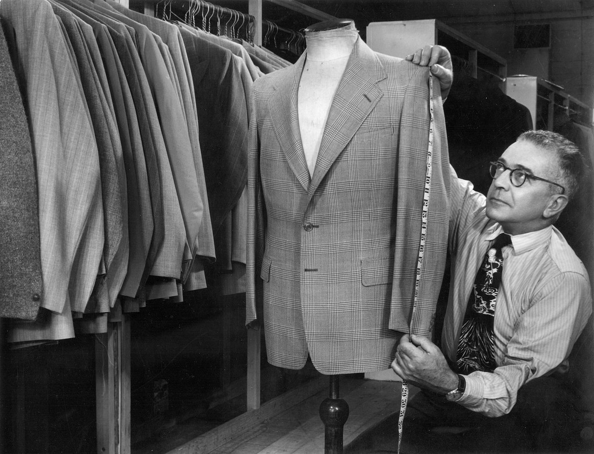 [Tailor measuring a jacket sleeve, Berkeley Apparel, North Melbourne (1950)