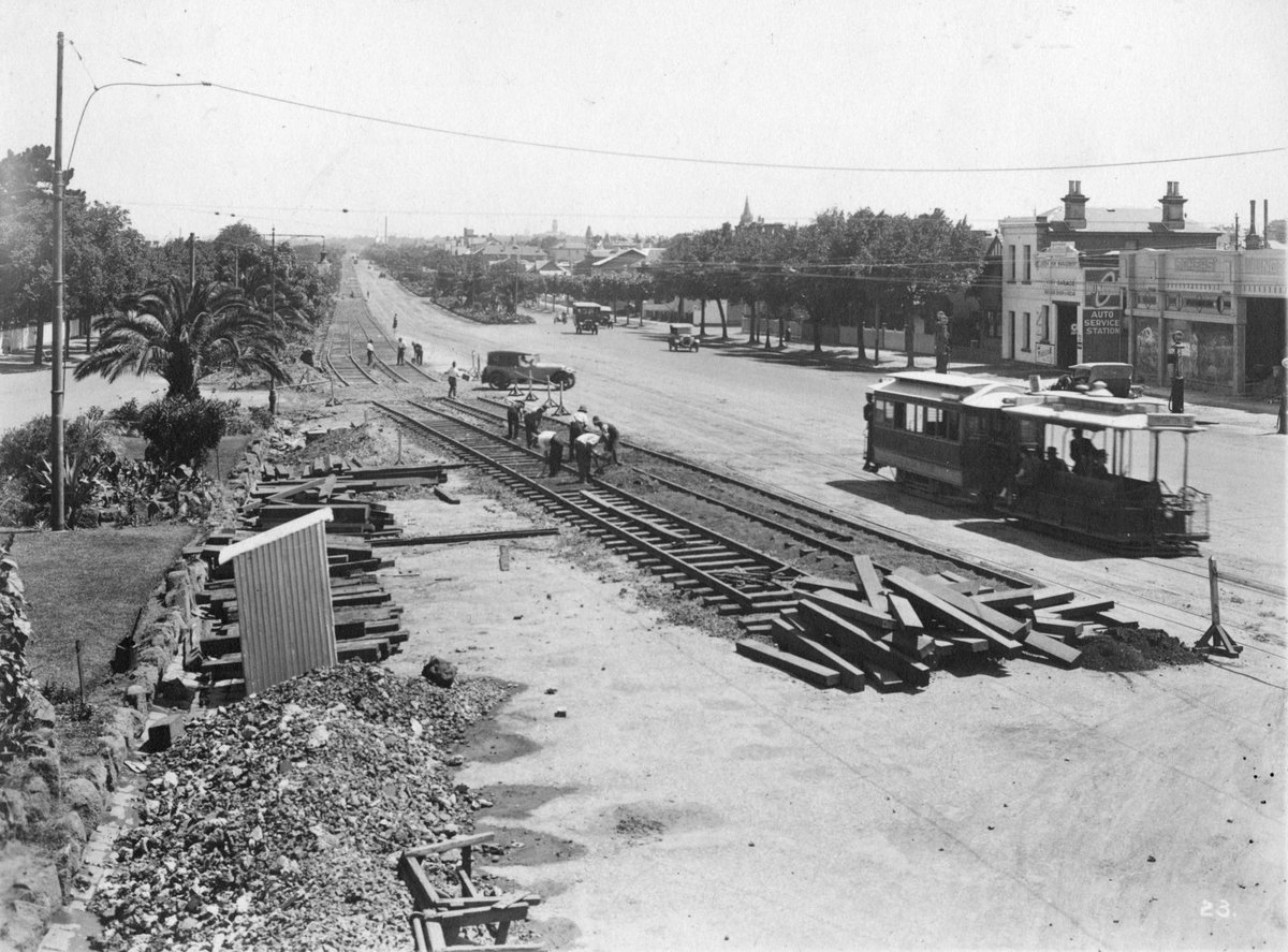 Construction of electric tramway, possibly in St. Kilda Road, Melbourne, Melbourne City (c. 1925)