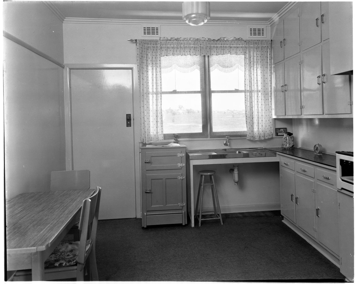 Kitchen interior, showing sink and ice-chest in a completed house on the Coburg Housing Estate (c. 1949)