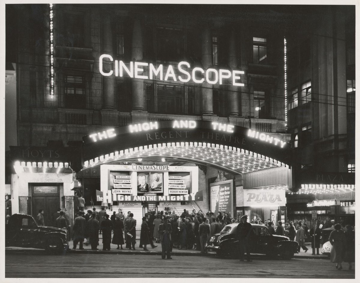 Hoyts Plaza, Regent Theatre, Collins Street, at night during season of 'The High and the Mighty', Melbourne City (1954)