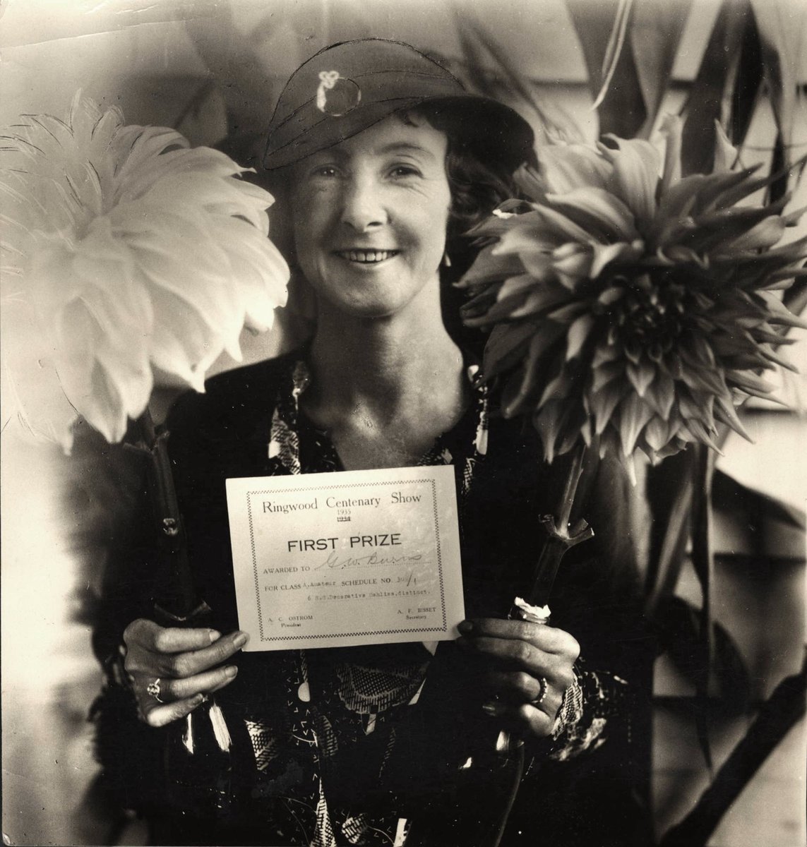 Mrs. G.W. Burns holding her First Prize certificate for growing dahlias awarded at the Ringwood Centenary Show, 1935 (1934)