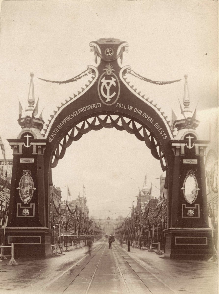 Bourke Street, Melbourne, looking towards Parliament House, through archway erected for Royal Visit, East Melbourne (c. 1901)