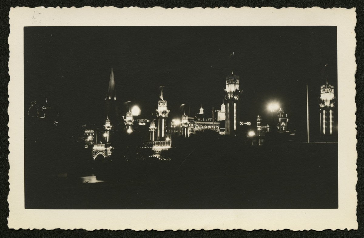 Elevated view across the Yarra River showing Melbourne skyline at night, Melbourne City (1930–50)