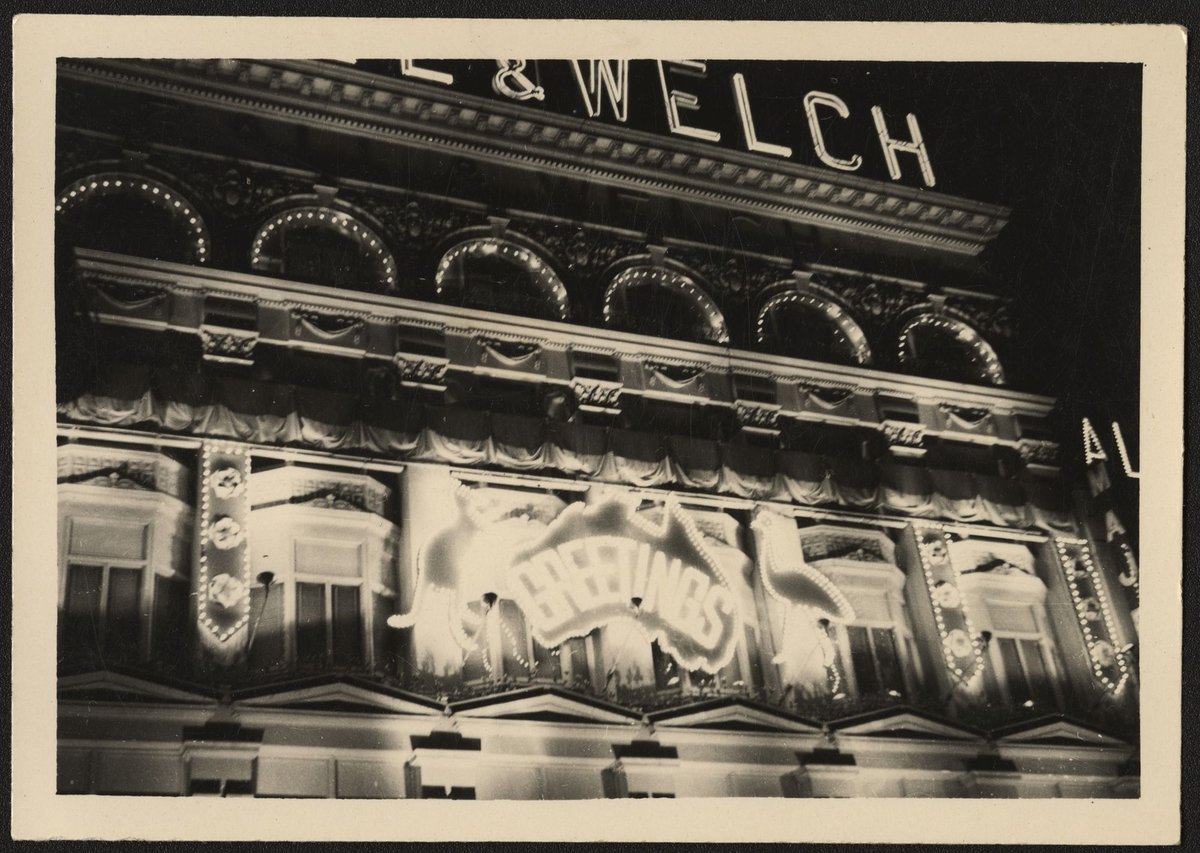 Lit up facade of Ball & Welch store, Bourke Street, Melbourne, Melbourne City (1954)