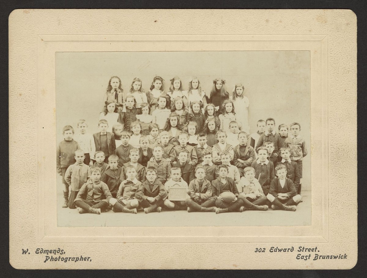 Group of children at Fitzroy Primary School, gathered for a school photograph (1910–13)