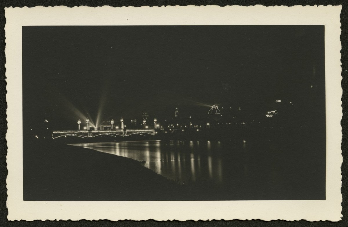 View looking north west across the Yarra River showing Princes Bridge at night, Melbourne City (1930–50)