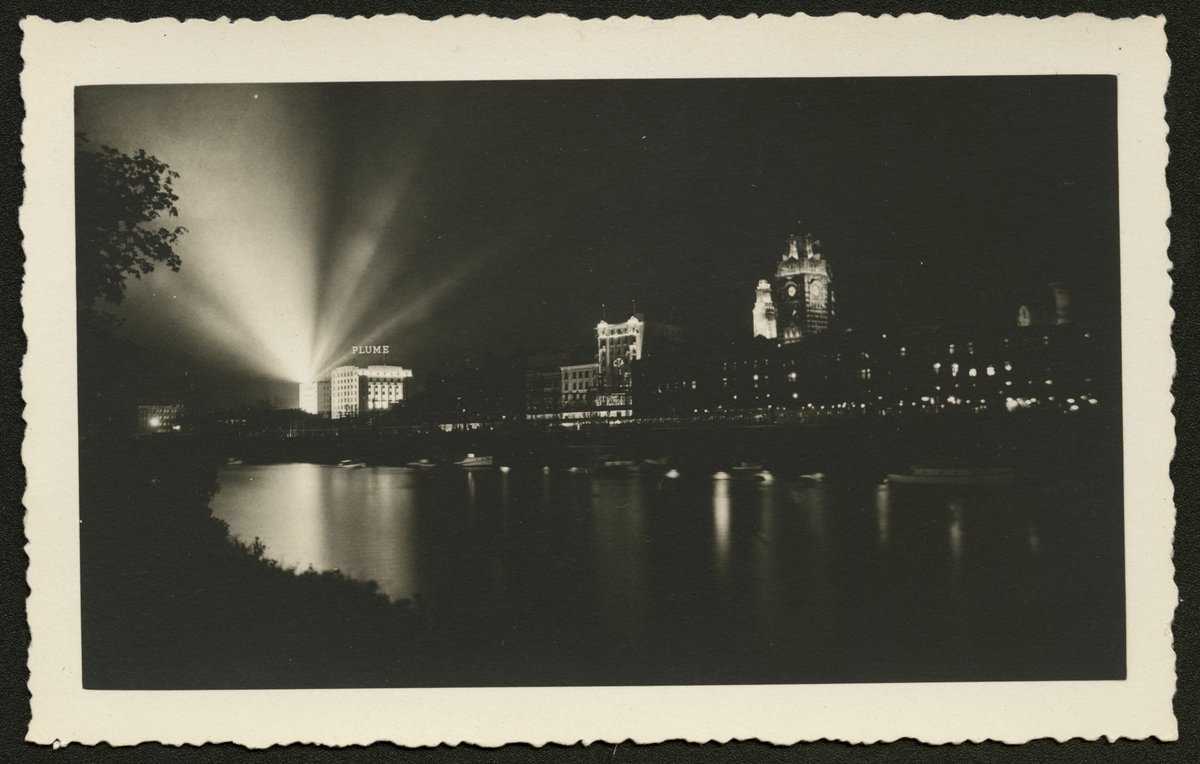 View looking north west across the Yarra River showing Princes Bridge at night, Melbourne City (1930–50)