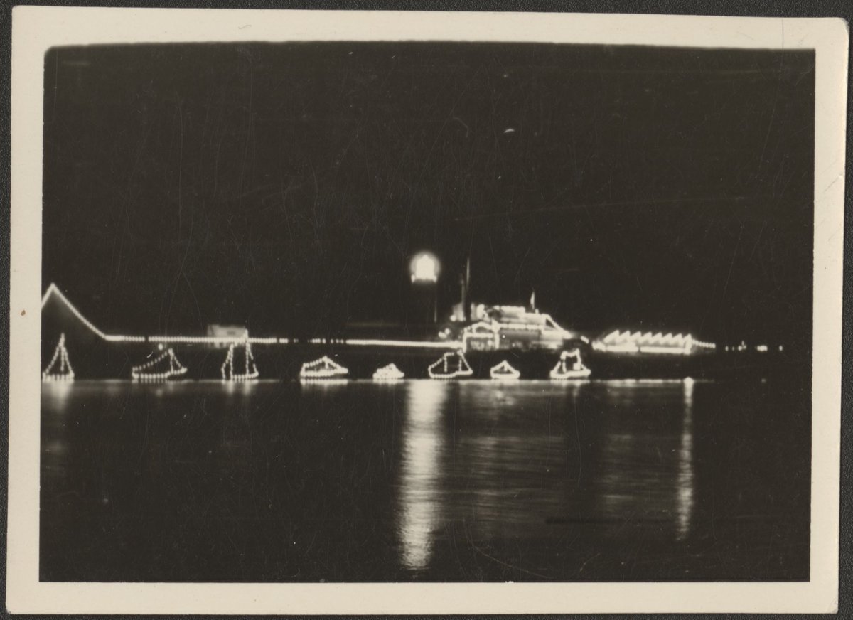 Bridge across Yarra River, outlined in lights, Melbourne (1954)