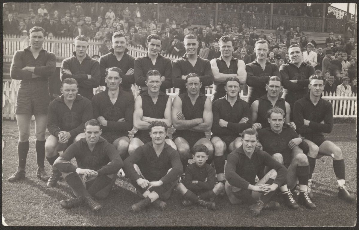 Fitzroy Football Club players on playing field, grouped for photograph (1930–40)