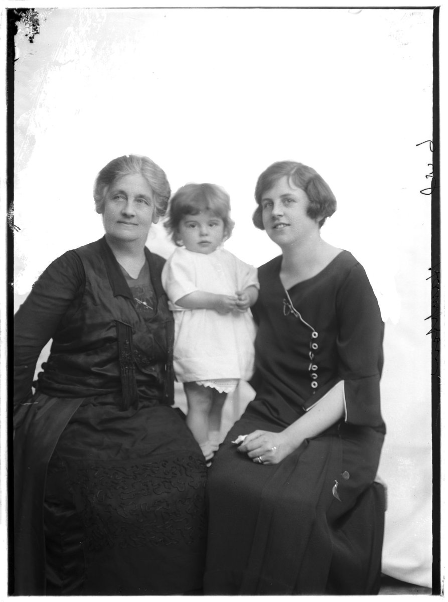 Studio portrait of probably three generations of the Hampton family, grandmother on left, mother on right and child in centre (1920–30)