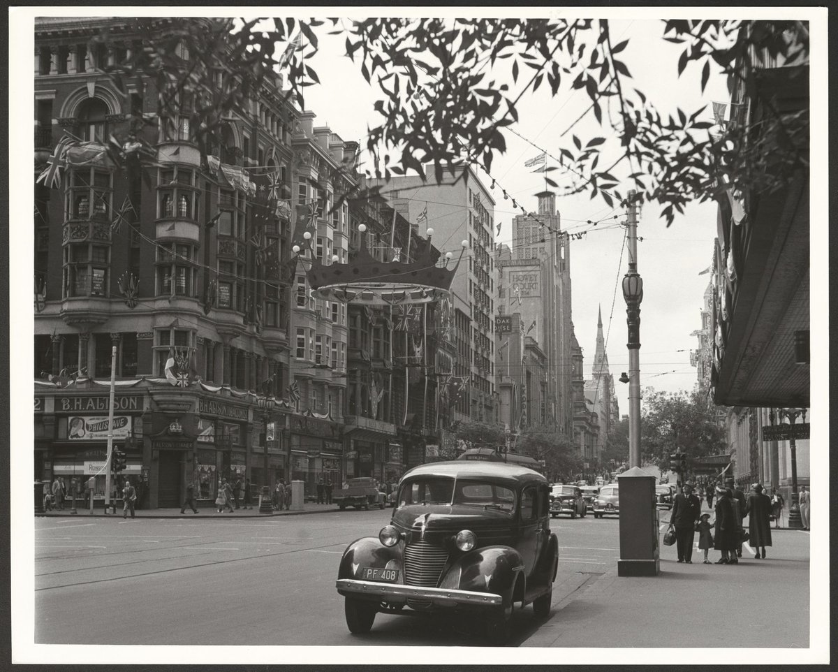 Collins and Elizabeth Street intersection, Melbourne, decorated for the 1954 Royal Tour by Queen Elizabeth and Prince Phillip, Melbourne City