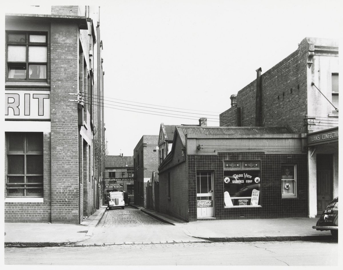 Spring Street - west side, looking down Surry Place, Melbourne City (1950)