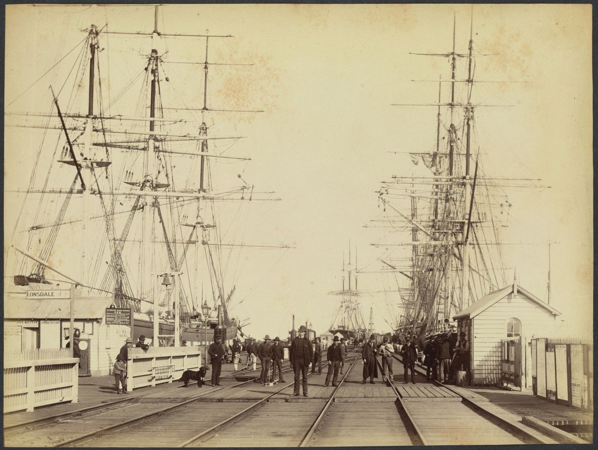 View on railway pier showing people, vessels and a sign for Williamstown Railway Steamer, Gem, Port Melbourne (1888?)