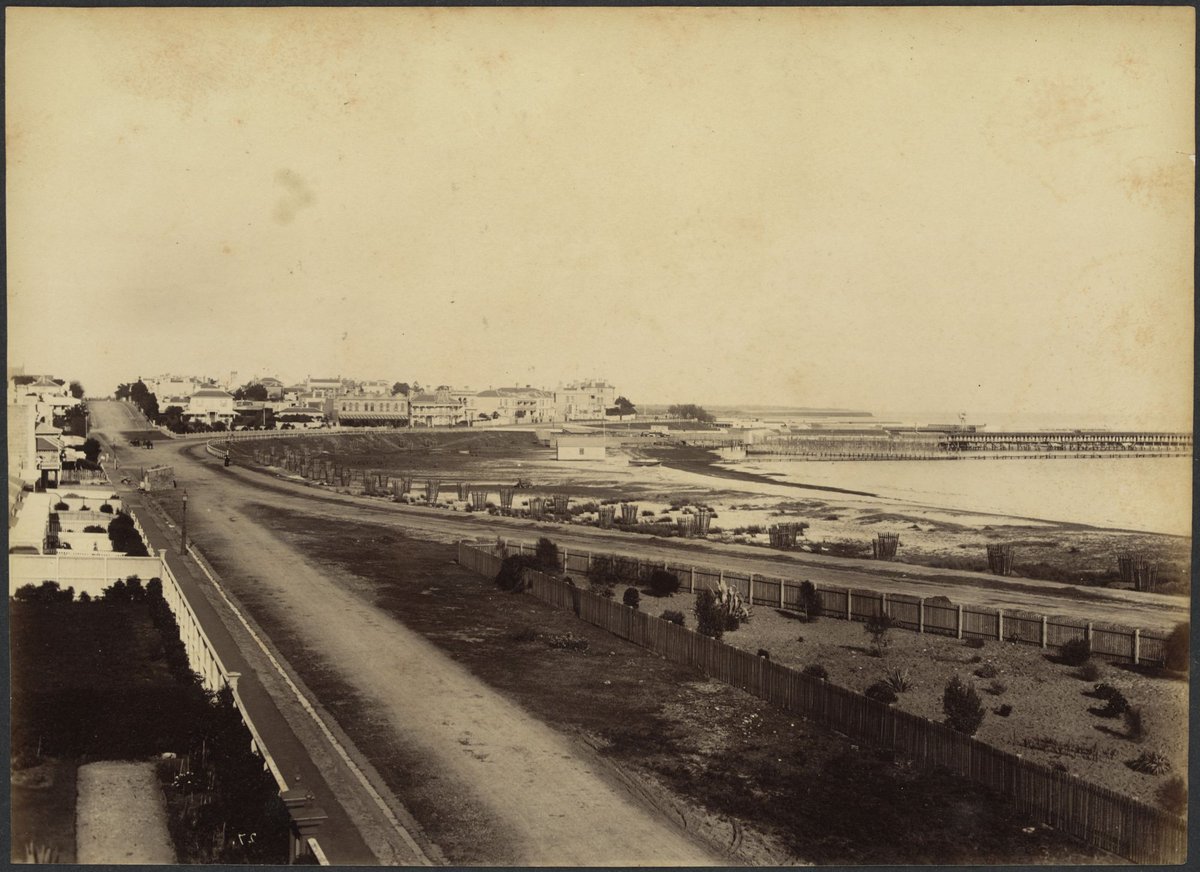 View of the Esplanade, Beaconsfield Parade and Fitzroy Street, St. Kilda; showing buildings, beach, pier and Hegarty's Railway Baths, St Kilda (1888?)