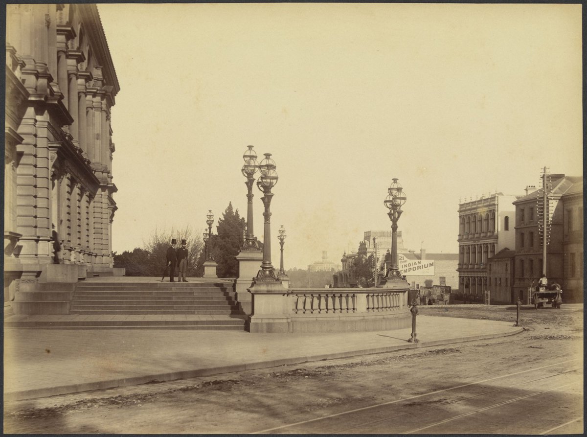 View across the Treasury steps looking south down Spring Street, showing Government House in the background, Melbourne City (1888?)