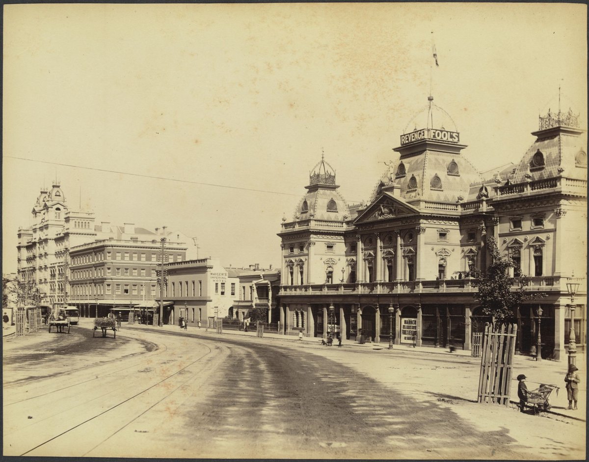 Princess Theatre while staging "Fool's Revenge" and view of Spring Street, showing Mayger's Imperial Hotel and the Windsor Hotel, Melbourne City (1888?)