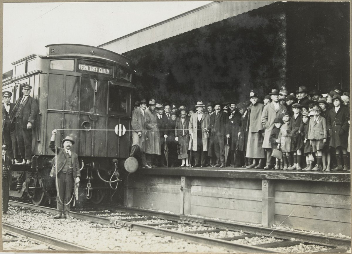 Electrification of section, Ringwood to Upper Fern Tree Gully First Train.12.10.1925. [Viewed from across the tracks with train in foreground.]