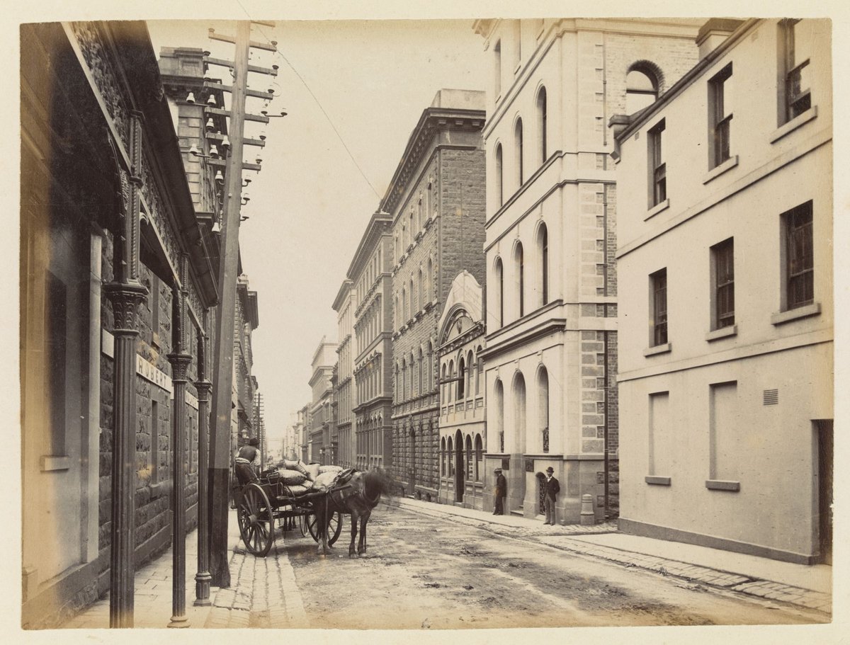 Looking west on Flinders Lane from the intersection with Swanston Street, Melbourne City (1883)