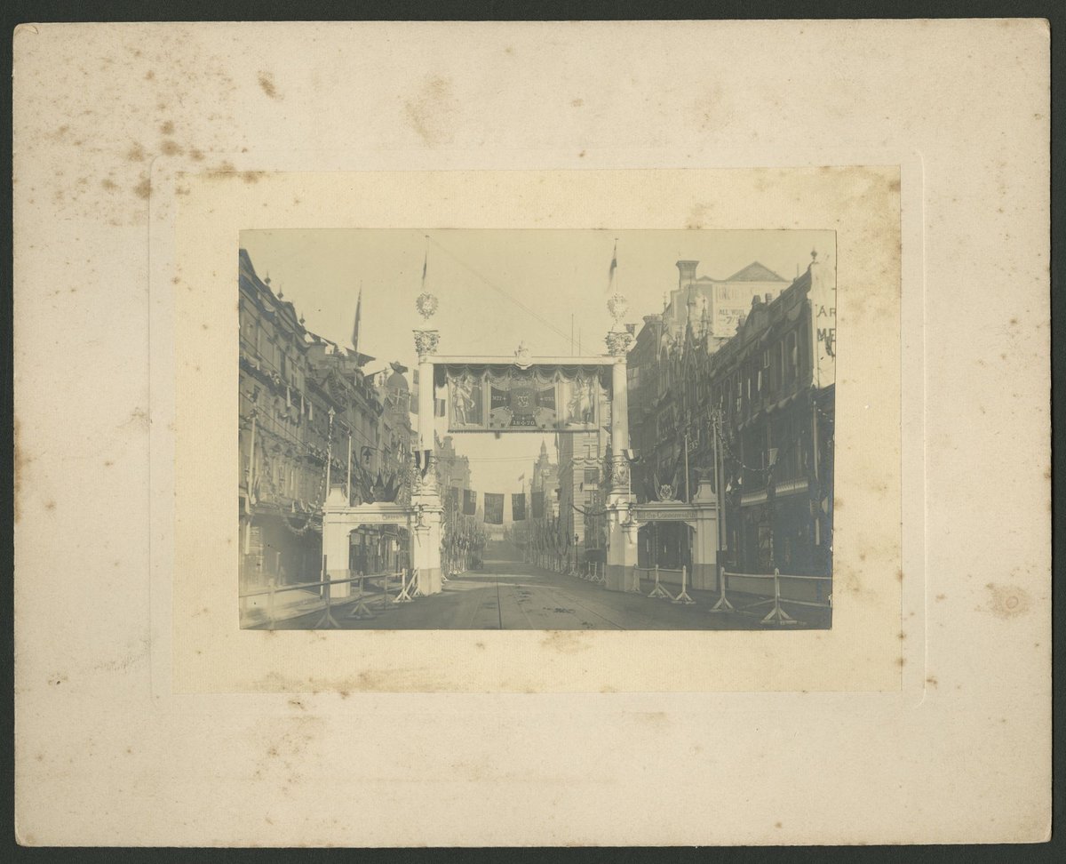 German citizens' arch across Collins Street, for the visit of the Duke and Duchess of Cornwall and York, Melbourne City (1901)