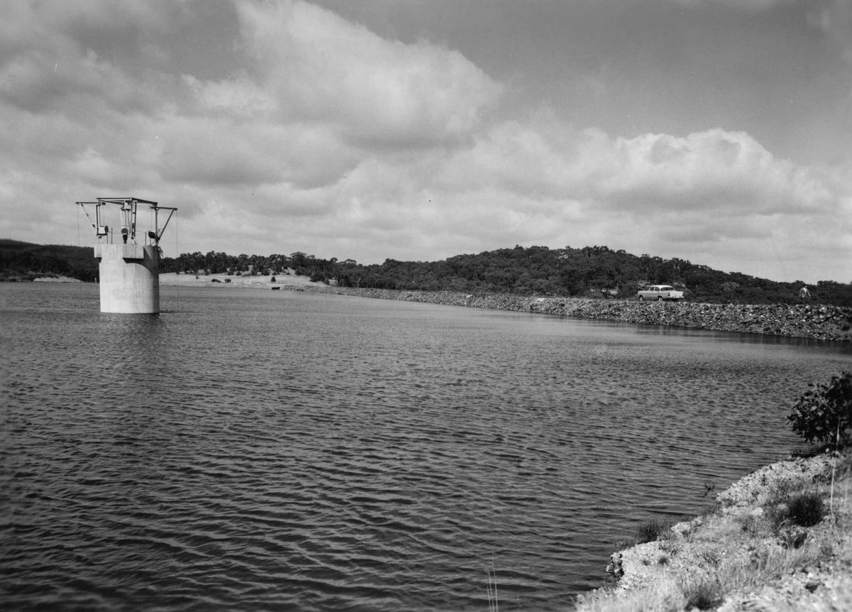 McCay Reservoir with embankment and name and information board (1960–63)