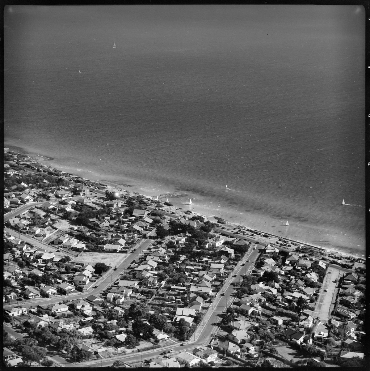 Aerial views of coastline and town of Chelsea, Victoria (1950)