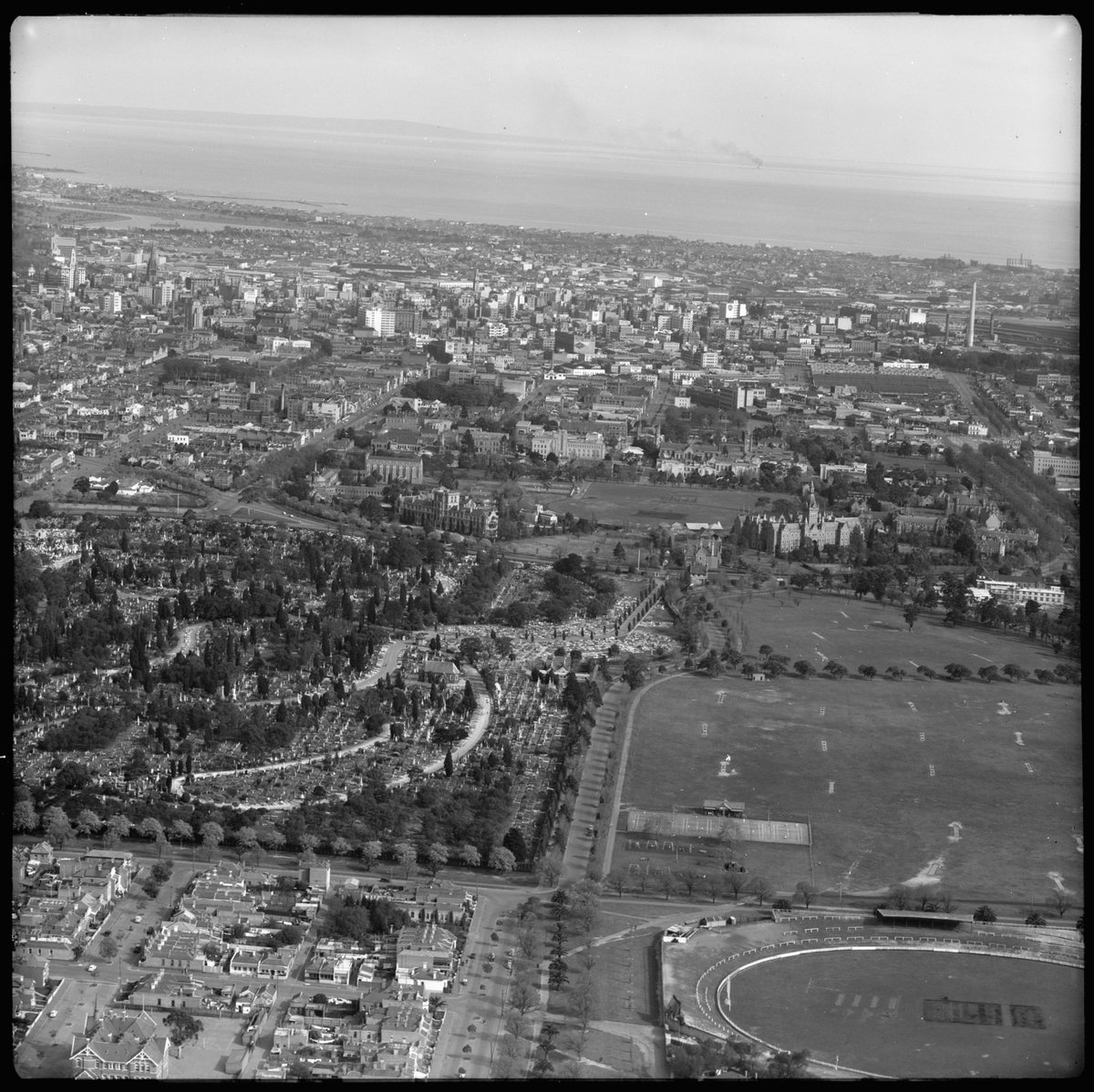 Aerial view looking south from Carlton towards Melbourne and Port Phillip Bay (1952)