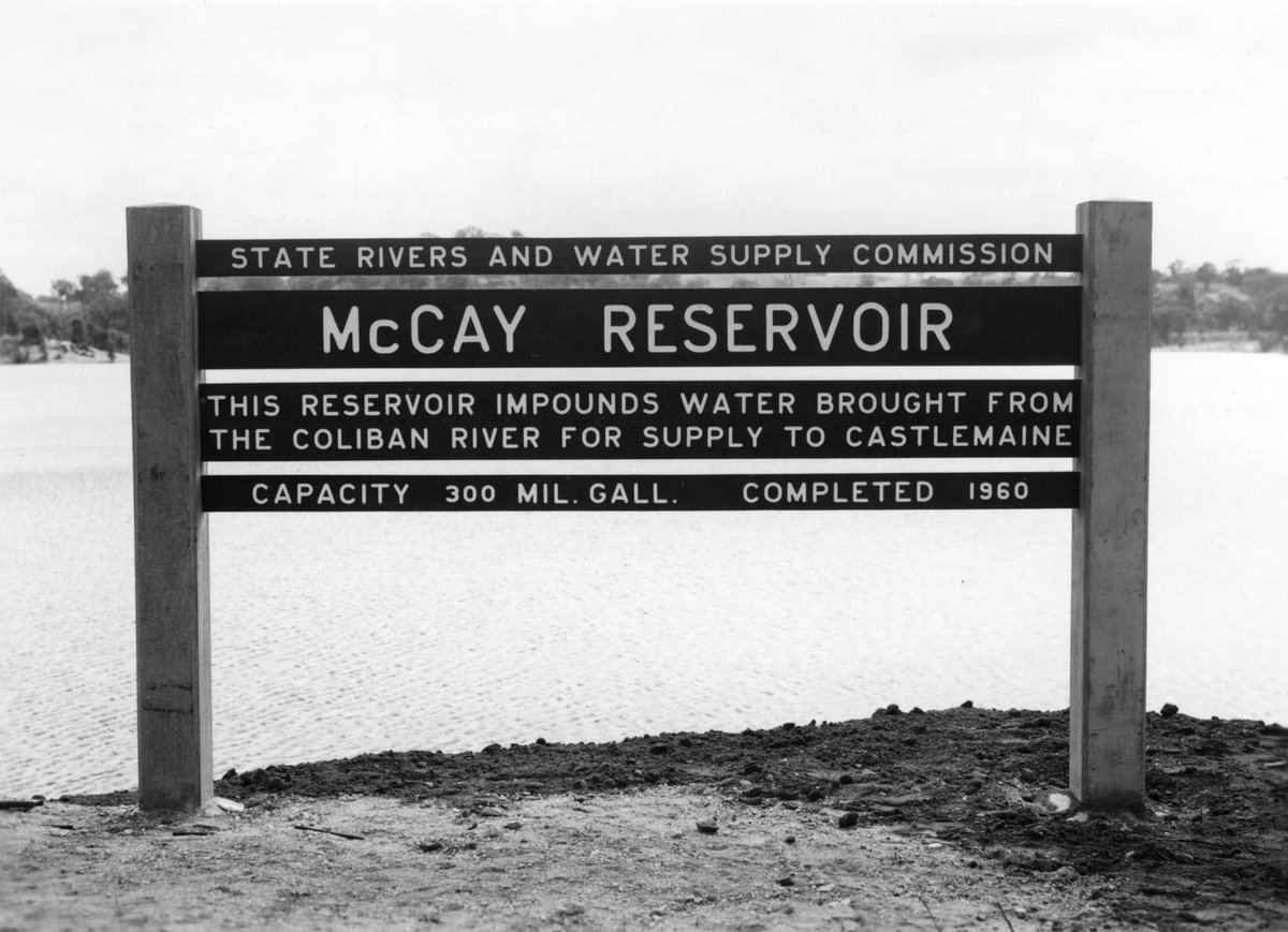McCay Reservoir with embankment and name and information board (1960–63)