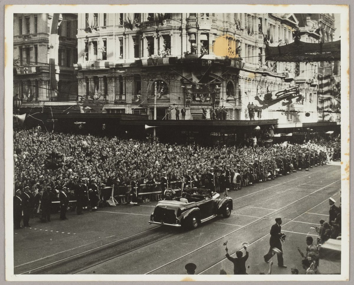 Elevated view of Queen Elizabeth II and Prince Philip in car on Collins Street, Melbourne City (1954)