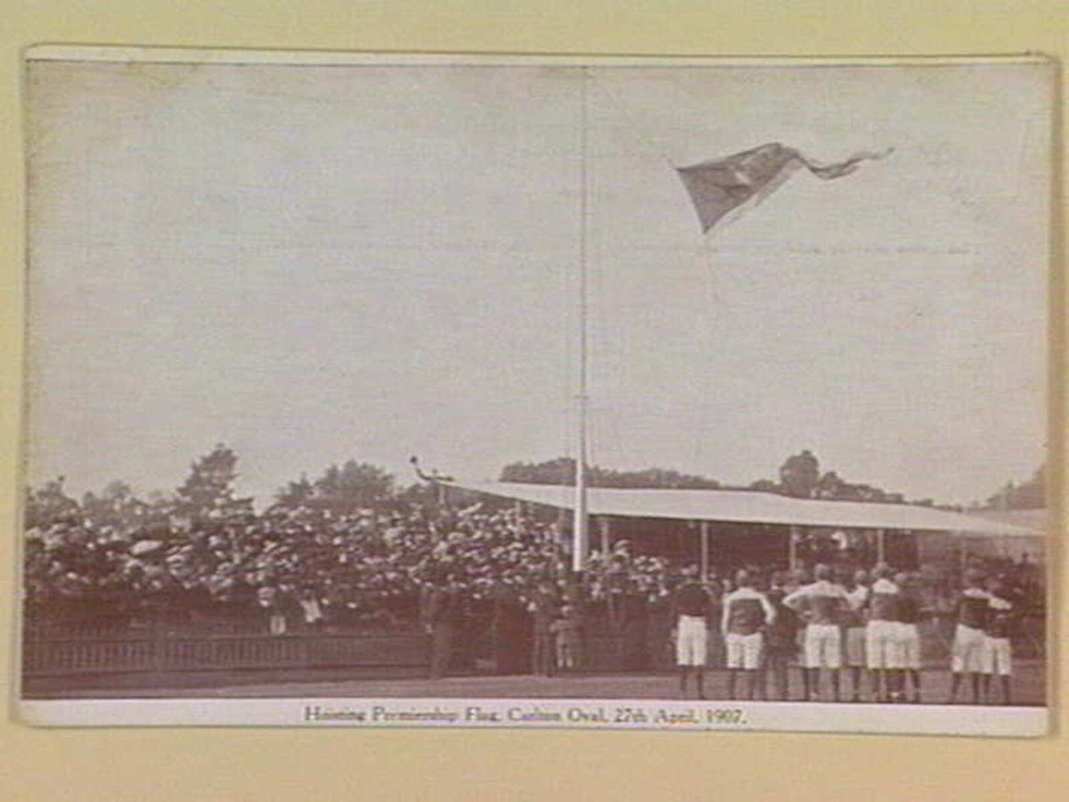 Hoisting Premiership Flag, Carlton Oval, 27th April, 1907 (c. 1907)