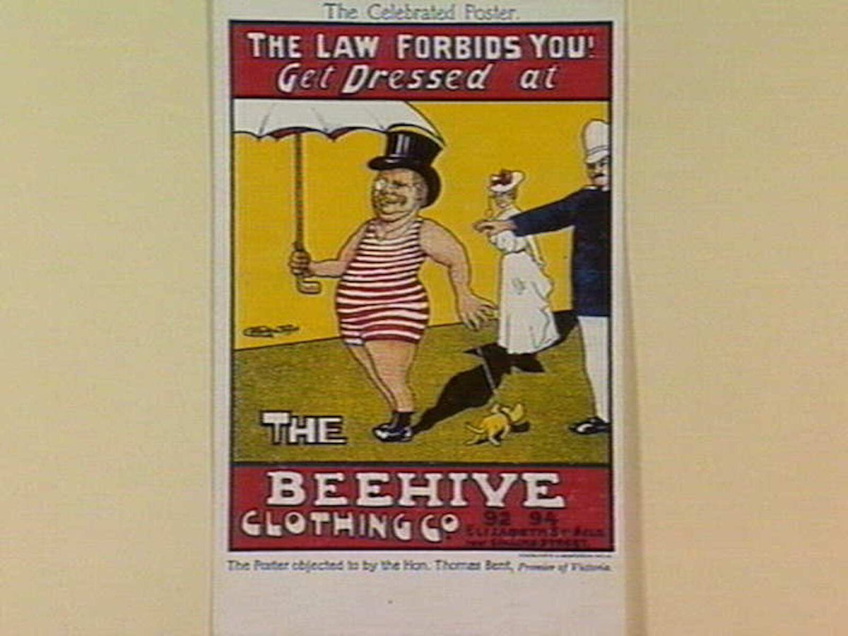 THE LAW FORBIDS YOU! Get Dressed at THE BEEHIVE CLOTHING CO.94-94 ELIZABETH ST. MELB. near COLLINS STREET, Melbourne City (c. 1905)