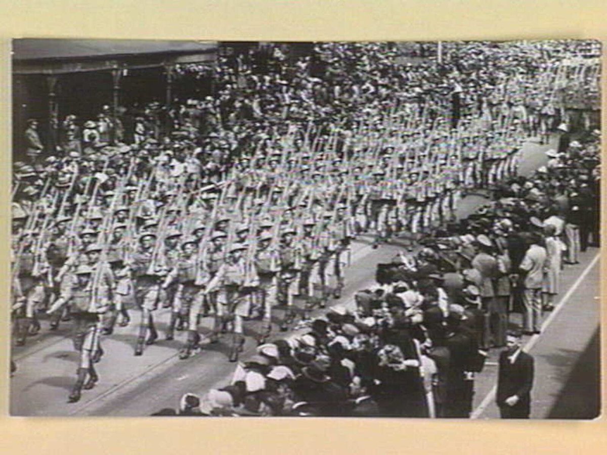 A.I.F. men from Victorian camps marching along Swanston Street, Melbourne in summer battle dress, Melbourne City (1939–45)