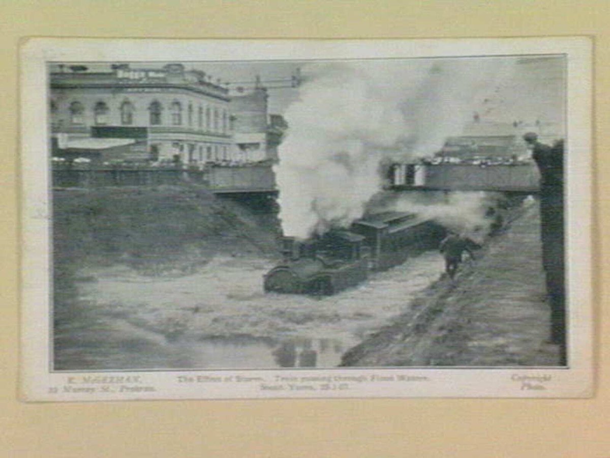 The Effect of Storm. Train passing through Flood Waters, South Yarra, 25-01-07 (c. 1907)
