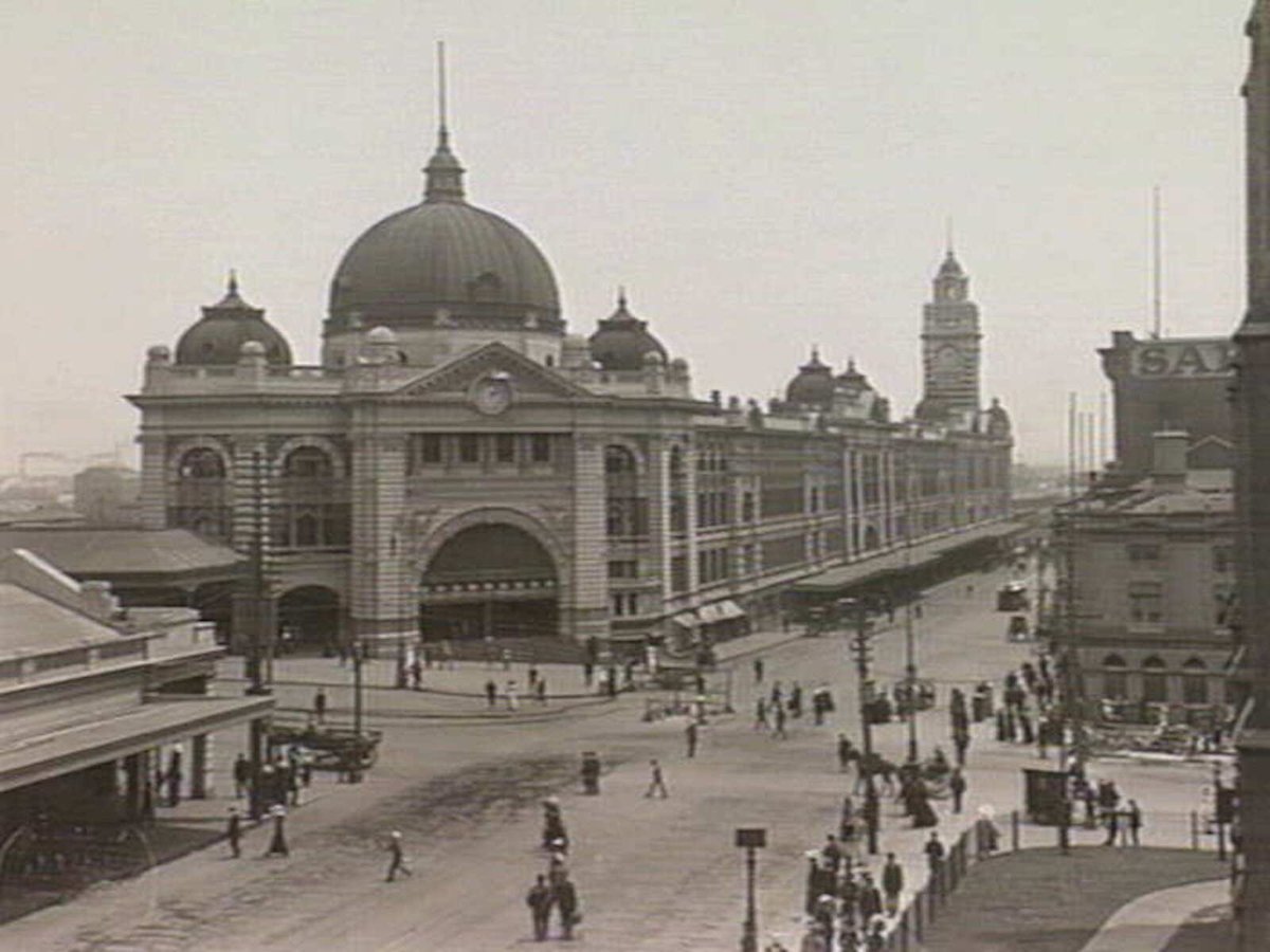 Intersection of Flinders and Swanston Streets, showing Flinders Street Railway Station, Melbourne City (c. 1920)