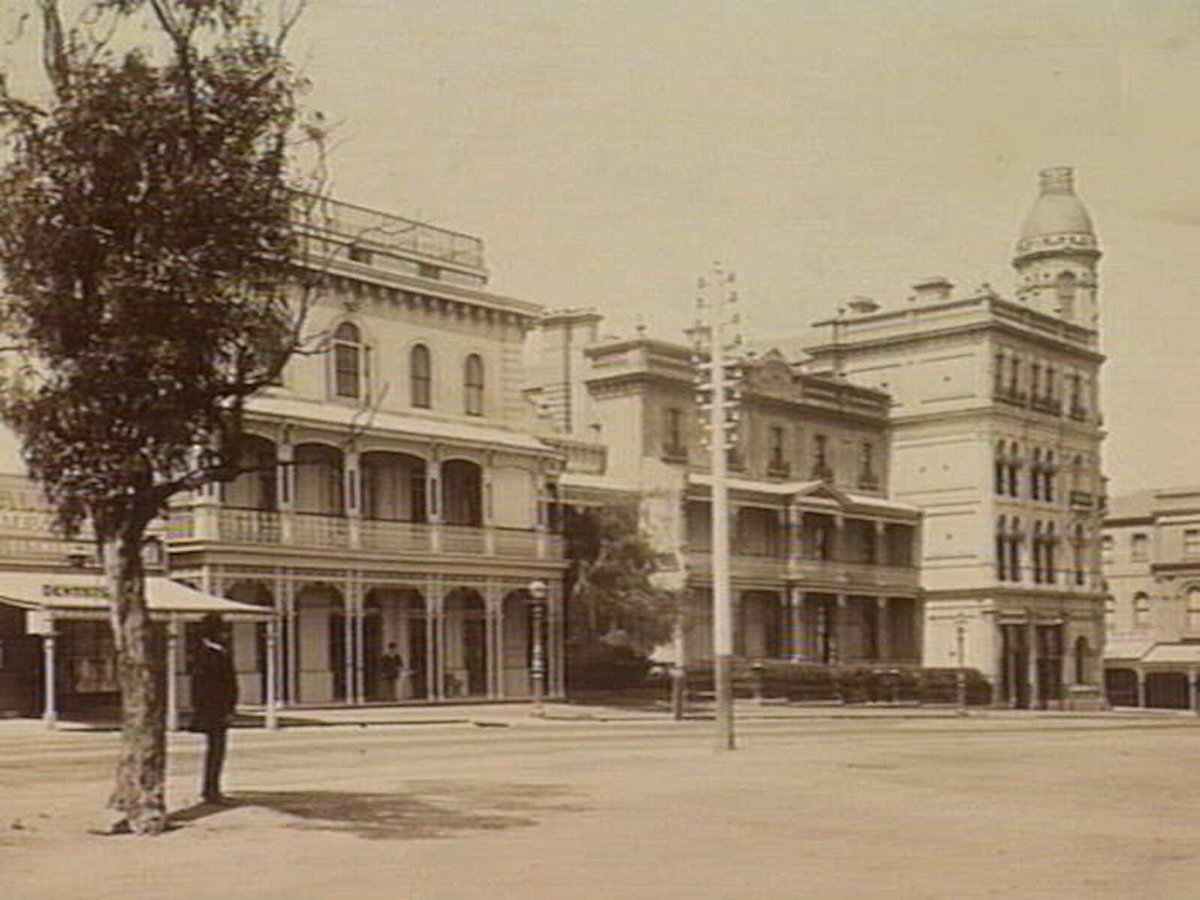 View of Fitzroy Street, south side, row of businesses, St Kilda (c. 1890)