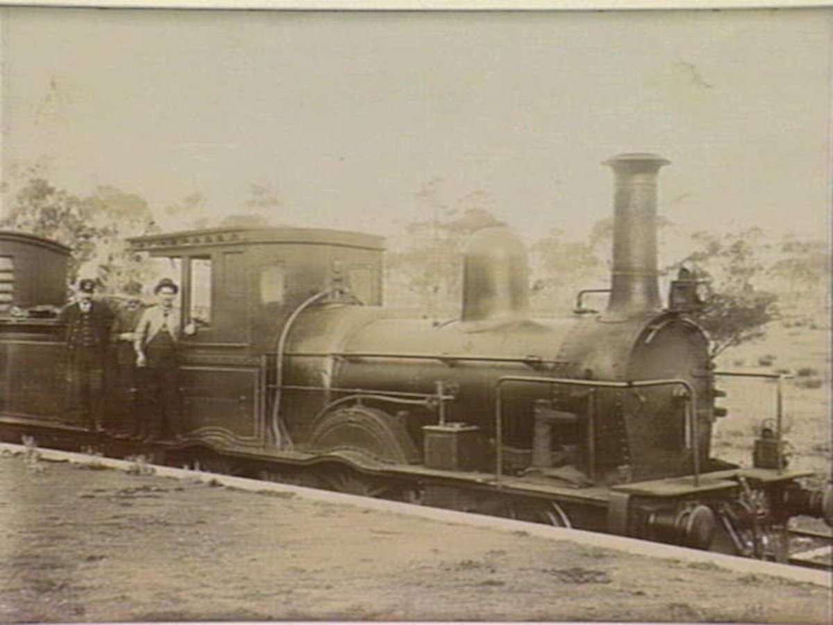 Ringwood, Mr Fred Kefferd in centre [of group of three workers standing on running board of Locomotive.] (c. 1900)