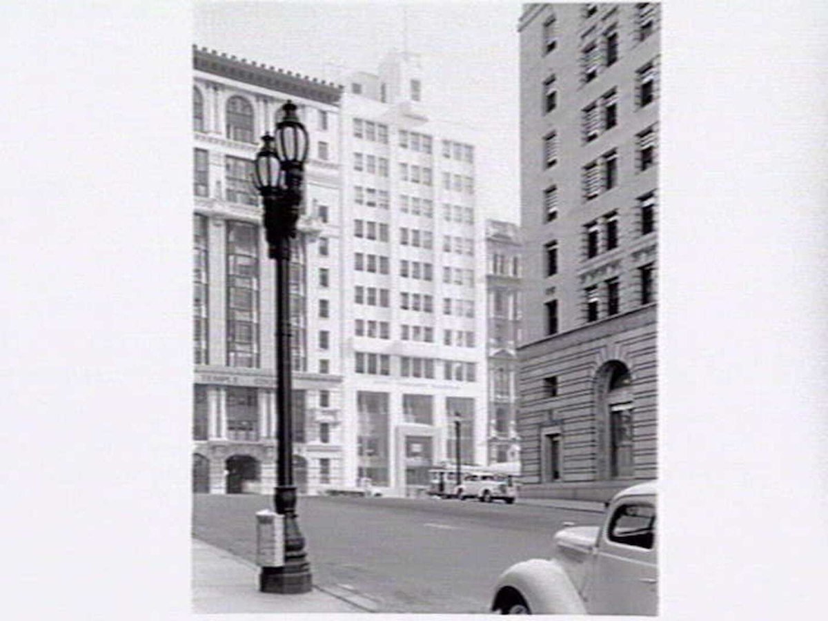 Collins Street from Market Street, showing Temple Court building 422-8 Collins Street, Royal Insurance building 414-8 Collins Street, and side of AMP Chambers, 419-25 Collins Street, Melbourne City (c. 1940)