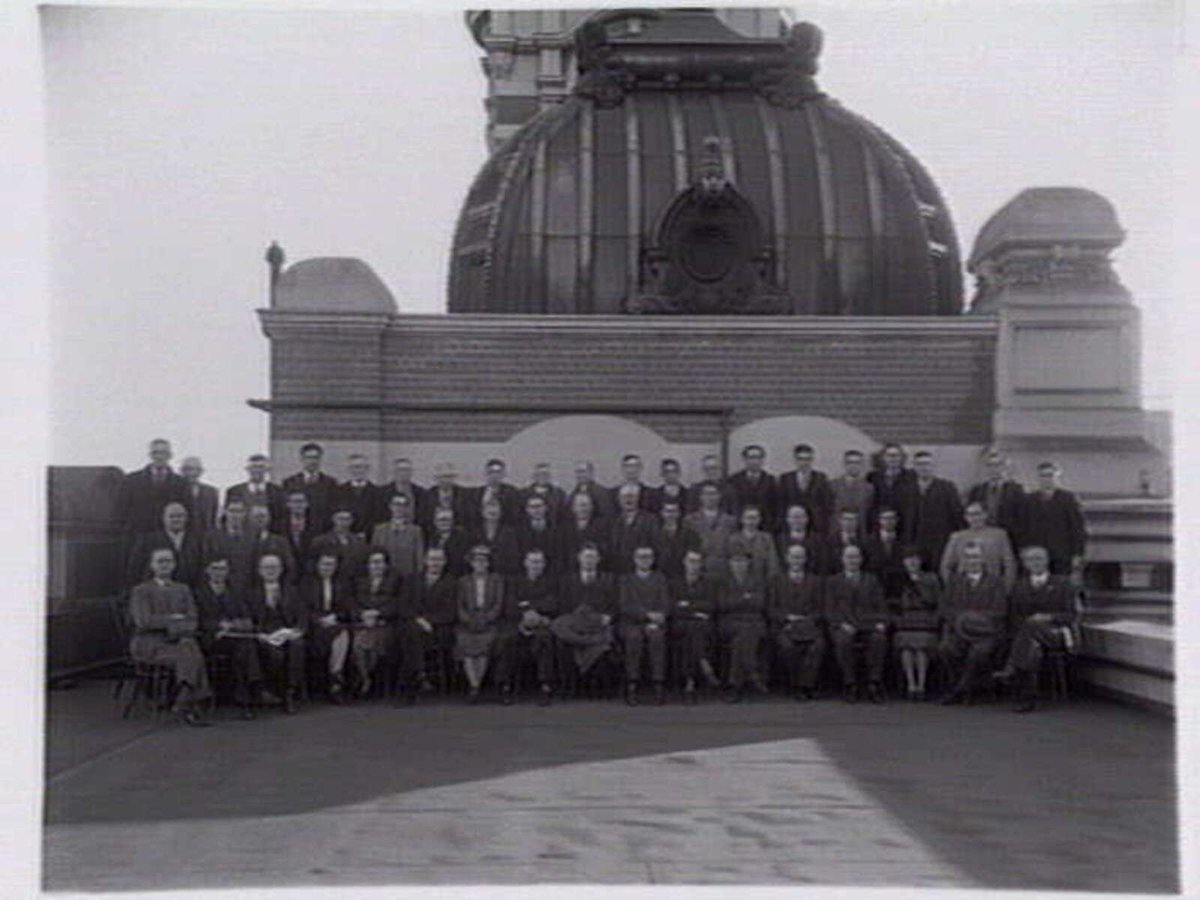 Victorian railways administrative staff on roof of Flinders Street Station, Melbourne City (1940s)