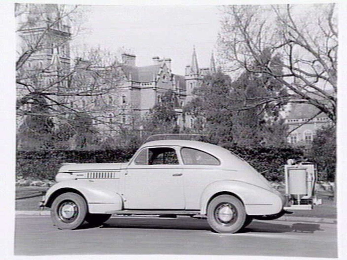 Pontiac All Enclosed Coupe (Sloper), auto gas producer fitted for use during wartime, outside Ormond College Melbourne University, Parkville (1940?)